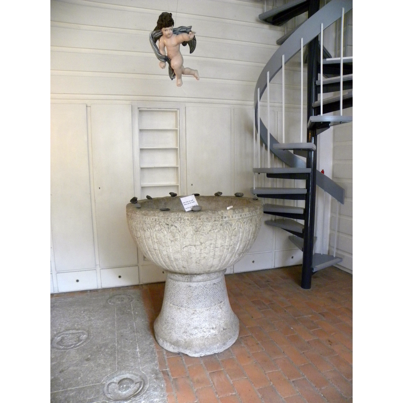Source caption: "Fotograferet af pastorin Peggy Josefien Kersten. Døbefonten taget i brug igen i 1960erne efter at have stået som blomsterkumme i Ludwigsburgs park." -- the medieval font was moved to the tower space during the ca. 2020 renovation of the church