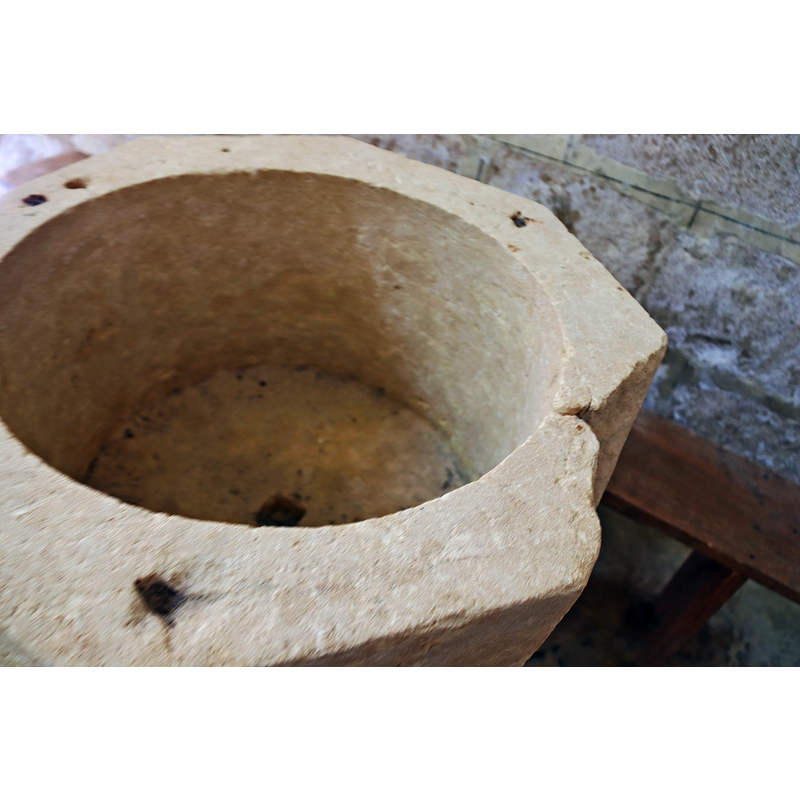 showing the many 'scars'related to the anchorings of earlier font cover(s)