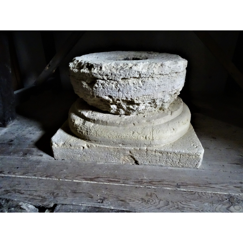 [NB: the purported original base is a composite of two parts: the upper block is roughly cylindrical and extremely damaged and eroded, while the lower part, moulded round top and plain square bottom, appears well preserved] [cf. FontNotes]