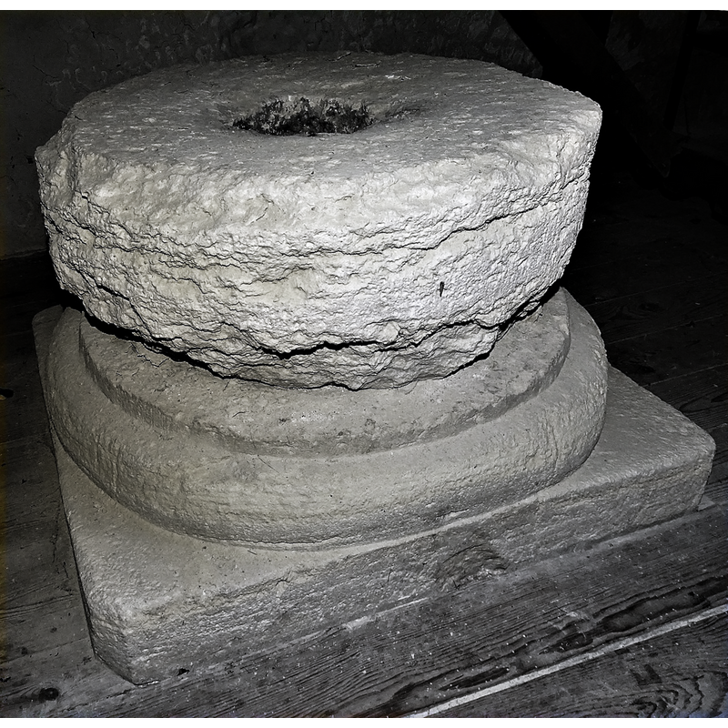 [NB: the purported original base is a composite of two parts: the upper block is roughly cylindrical and extremely damaged and eroded, while the lower part, moulded round top and plain square bottom, appears well preserved] [cf. FontNotes]