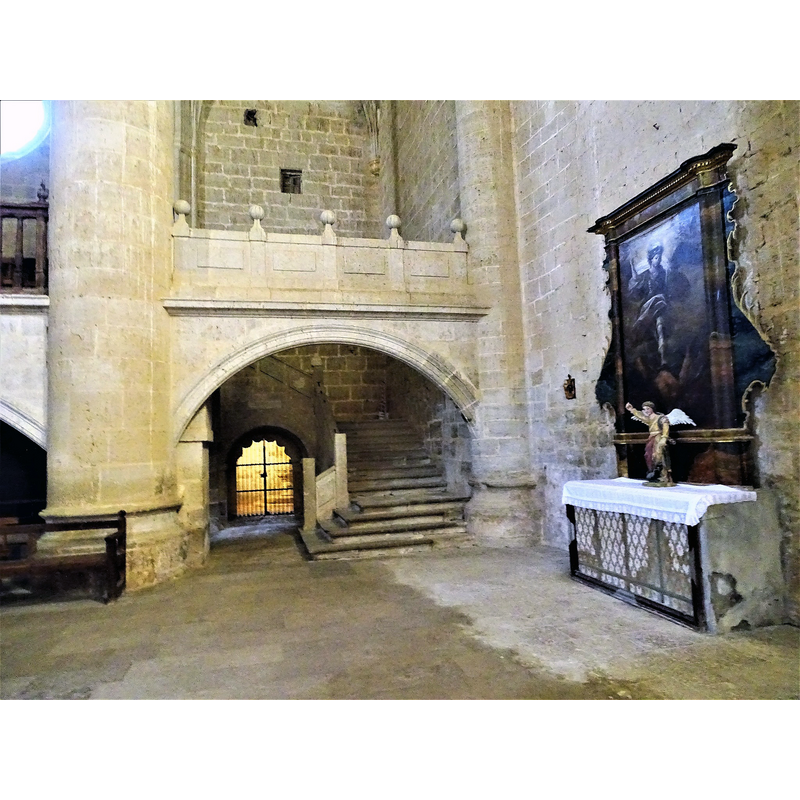 the illuminated door to the baptitery is seen here beneath the galler, to the left of the stairs