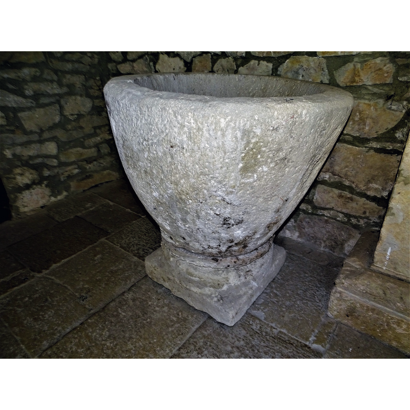 the baptismal font originally from Relloso shown here at the entrance of the church in Quincoces de Yuso