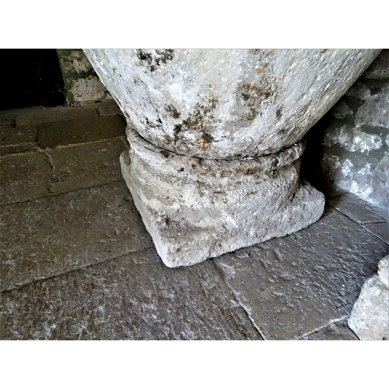 the baptismal font originally from Relloso shown here at the entrance of the church in Quincoces de Yuso