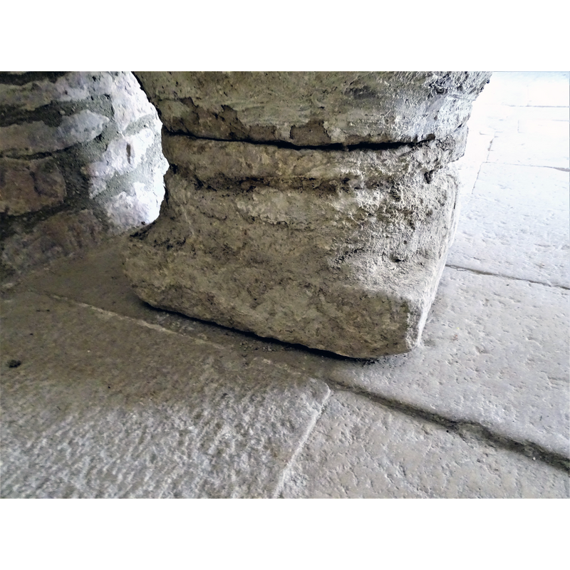 the baptismal font originally from Relloso shown here at the entrance of the church in Quincoces de Yuso