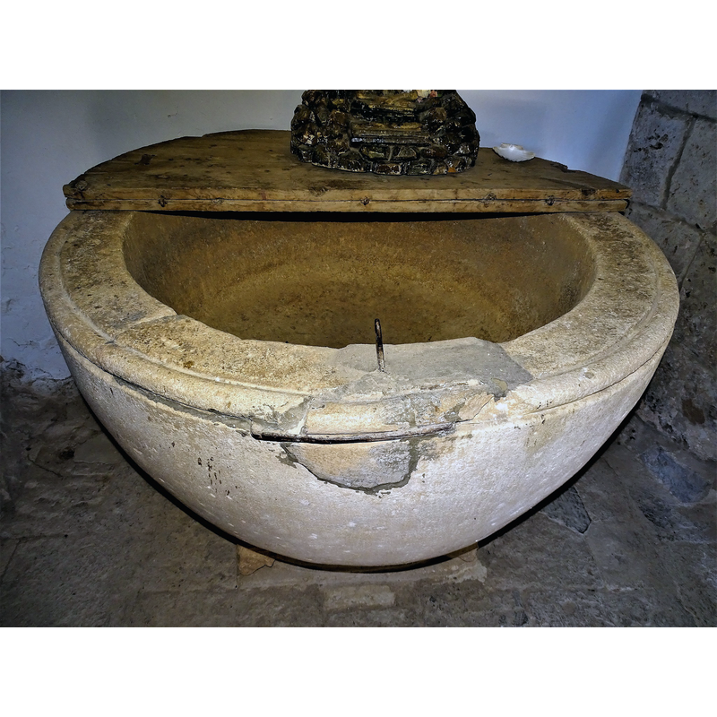 showing a damaged area of the upper rim that has been repaired and a metal staple re-installed in the repair