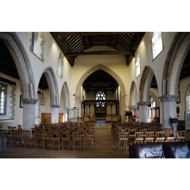 Source caption: "The nave facing east to the chancel of the Grade I listed Holy Cross Church on the B1417 Braintree Road, Felsted, Essex, England."