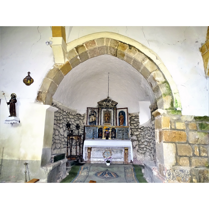 the interior of the church was altered from the original East-West single nave of the Romanesque church; the east end (chancel) of the old nave became a side chapel, while the north end of the new nave is now the new chancel -- seen here is the old chancel arch and east end
