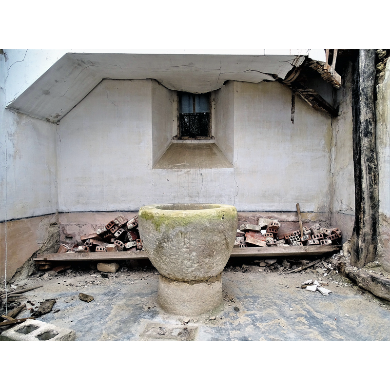 the ruined church in January 2023 -- the old font now located at the west end of the ruined nave