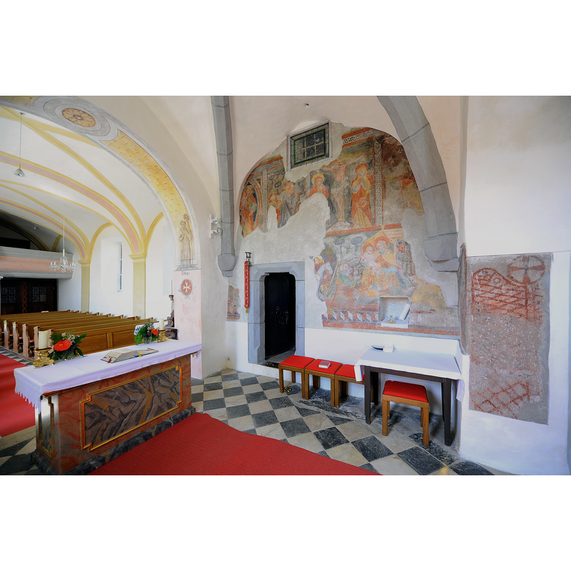 Source caption: "Turm-Chorquadrat mit gotischen Fresken und spätgotischem Taufbecken in der Pfarrkirche Heiliger Lambert in Pörtschach am Berg in der Gemeinde Maria Saal, Bezirk Klagenfurt Land, Kärnten / Österreich / EU" -- although mentioned in the caption the late-Gothic baptismal font is not included in the image, as it located on the opposite side, in the southeast corner