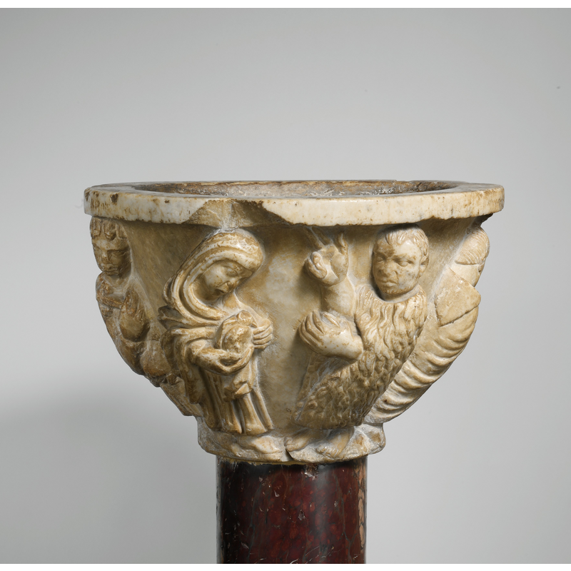 St Rainerius depicted in a hair-shirt; other scenes from his life depicted around the basin sides