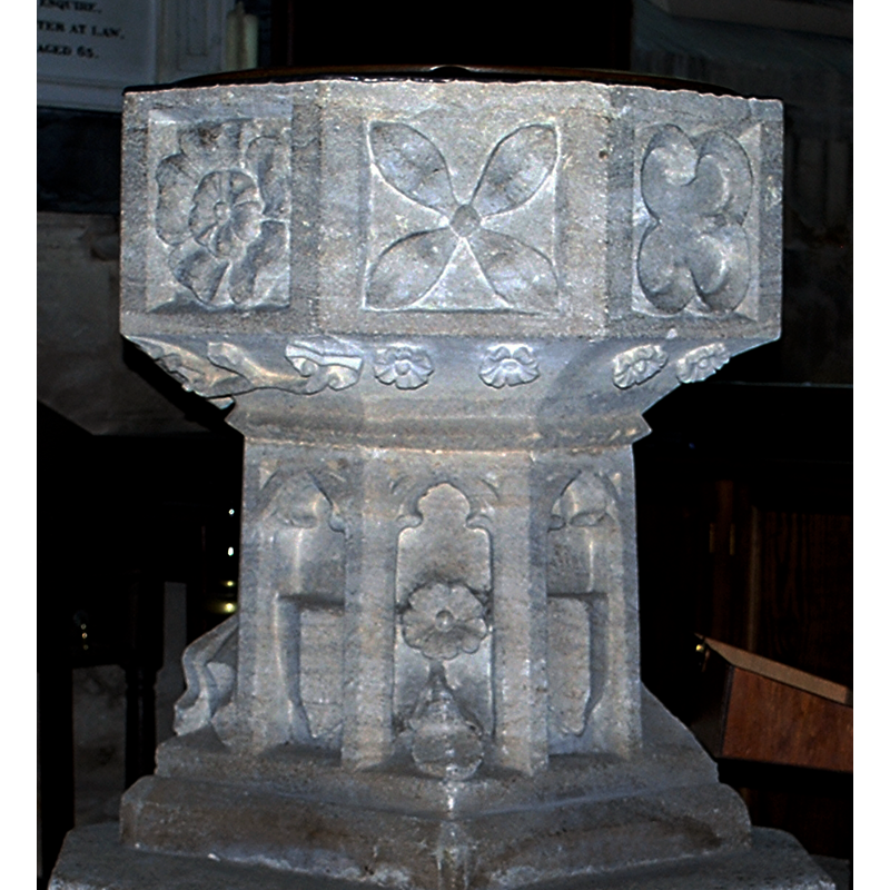 Source caption: "Bradford-on-Avon Church (Holy Trinity), Wiltshire, 19 July 2015. Pictured is the font, which seems to be Perpendicular but may be Victorian neo-Gothic." The entry for this church in Historic England [List Entry Number: 1364540] notes: "The font has a Perp octagonal bowl with unmoulded square panels, perhaps recut in the 17th century with quirky geometric patterns; the stem has cusped panels and shields."