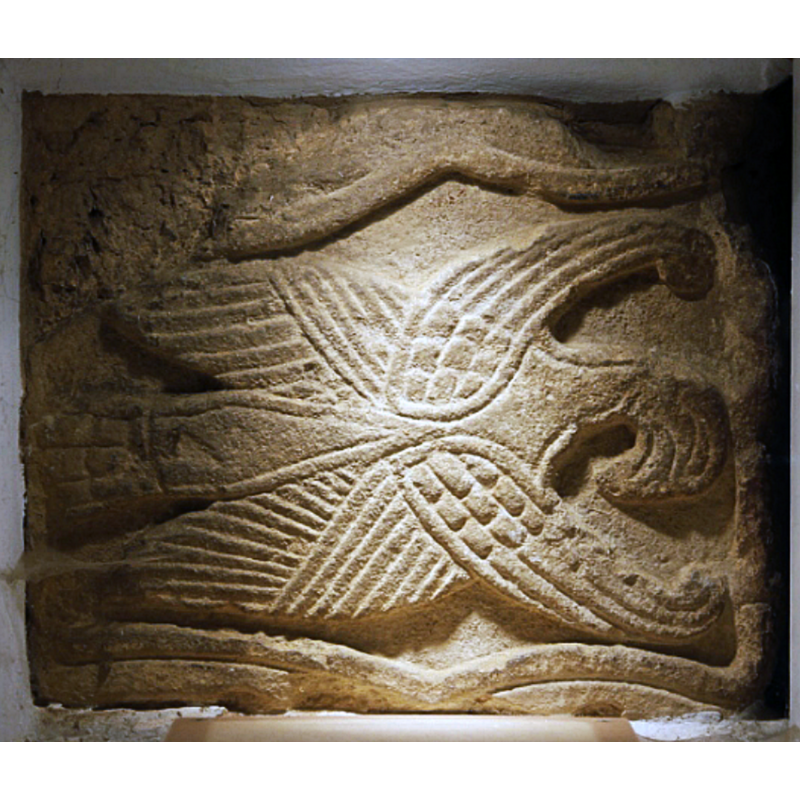 Source caption: "Saxon relief of the eagle of St John the Evangelist, set inside the south doorway of All Saints' parish church, Brixworth, Northamptonshire"
