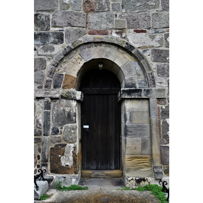 Source caption: "Kirk Hammerton, St. John the Baptist's Church: Anglo Saxon south door. Heavily restored on the right, the rest being a good example of fine Anglo Saxon stonework."
