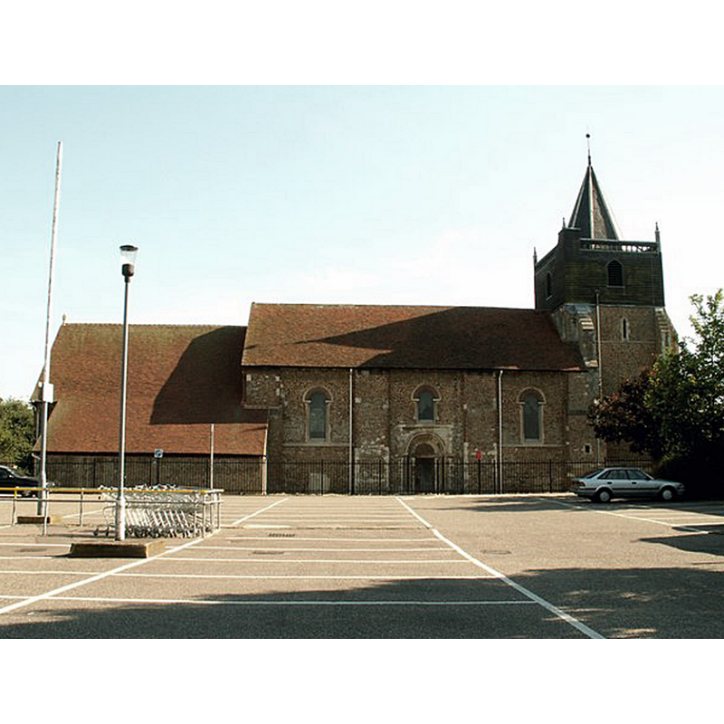 Source caption: "St. John the Baptist church, Great Clacton, Essex. It's hard to believe that before the Victorian era, Great Clacton was just a small village and Clacton-on-Sea would have been just farmland and perhaps the odd cottage. The whole of this area is now built up but you can pick out the original village buildings around the Norman church. The church was badly restored in 1865 but there is a lot of the old left to interest. The 15th century tower was never completed, hence the unusual timber structure on top."