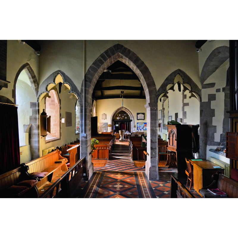 Source caption: "St Mary, Credenhill. Looking West through the unusual triple chancel arch." -- showing the font towards the west end of the nave
