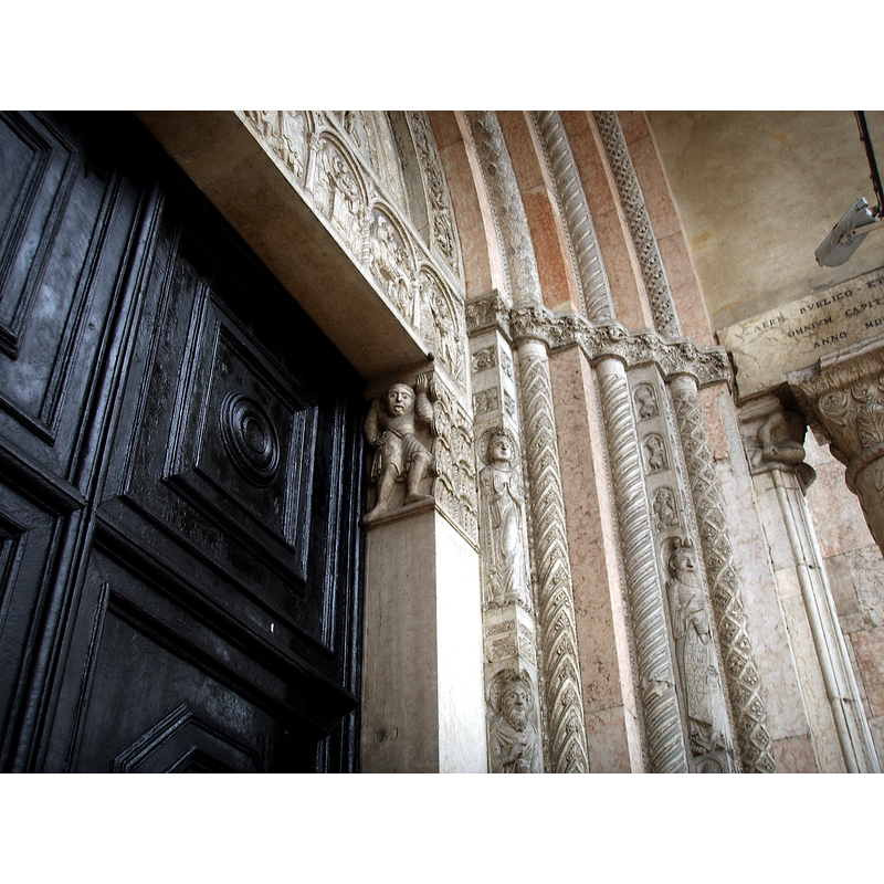 Source caption: "The right-side doorpost from the main portal of the Cathedral of Ferrara, sculpted by Romanesque artist "Magister Nicholaus" (12th century)."
