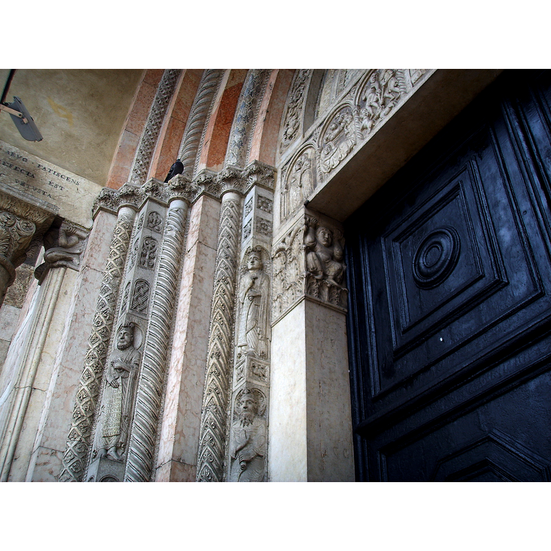 Source caption: "The left-side doorpost from the main portal of the Cathedral of Ferrara, sculpted by Romanesque artist "Magister Nicholaus" (12th century)."