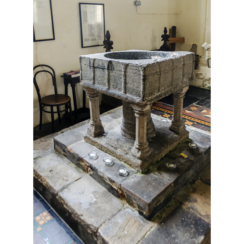 damaged and worn basin; most of the tops of the arches are missing, but they appear to be round