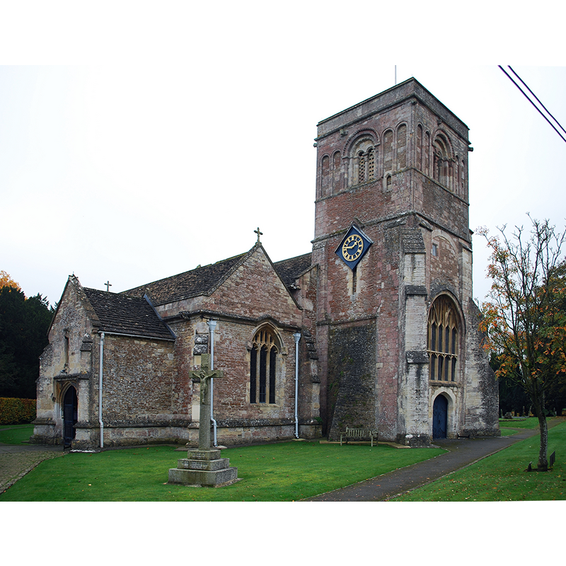 Source caption: "Beckington Church (St. George), 1 November 2015. The tower is 12th Century Norman, the chancel is 14th Century Decorated, the clestoried nave, north and south aisles and south chapel are 15th Century Perpendicular. Victorian restoration (1873) by Piers St. Aubyn. Pictured is the west tower, north aisle and north porch. Note the blind Norman arcading on the top tier of the tower. The window at the base of the tower is 15th Century Perpendicular insertion into a larger Norman one, the arch of which can be seem above. Although the tower has corner buttresses, there seems to be an odd, cruder buttress on the north lower side of the tower."