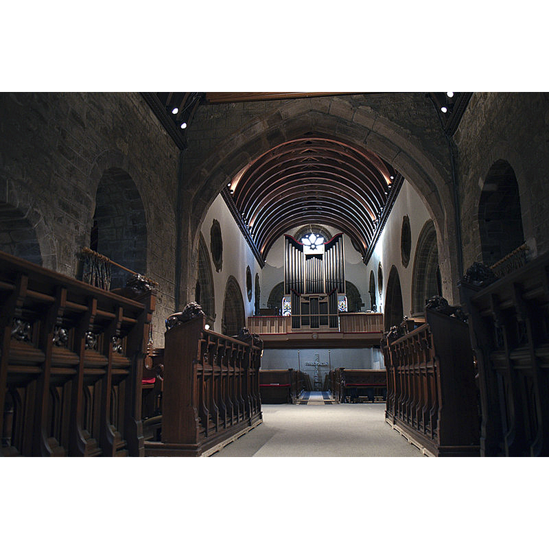 Source caption: "Canford Magna Church (Interior). The wonderful historic Saxon/Norman church at Canford has been without a dedication for many years. However, I have come across many websites which state the possibility of it being dedicated to St Augustine, as the east end is not orientated due east. 
The Church contains a significant amount of Saxon Architecture and the rest is Norman. It is the oldest building in the Borough of Poole." [cf. FontNotes]