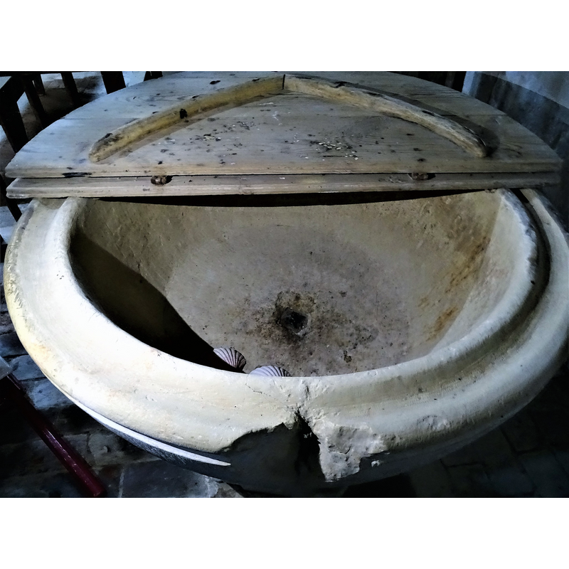 showing the centre drain and the damage from an old cover anchoring to the upper rim