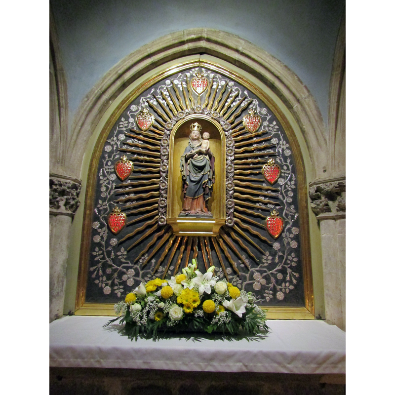 a side altar with a 15thC(?) Madonna and Child in a 20thC(?) retable