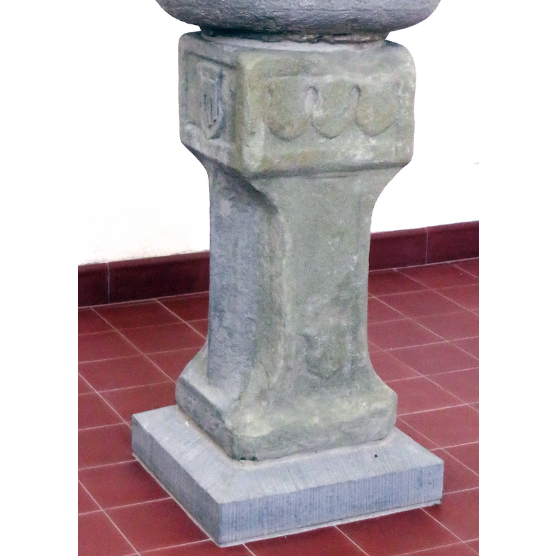 on one side of the square top of the base; may have been painted originally