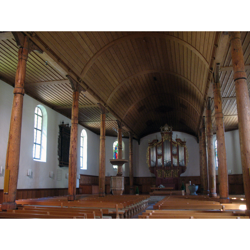 Source caption: "Evangelisch-Reformierten Kirche, Meiringen, Schweiz" -- the font is visible in the background, right of centre