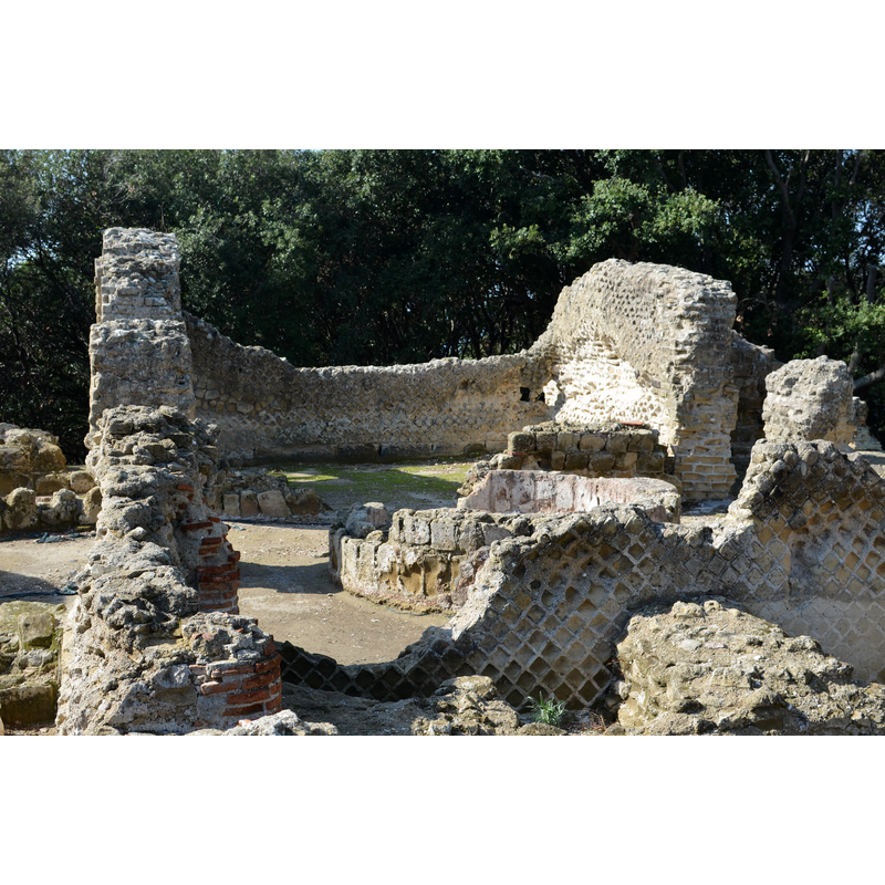 Source caption: "The remains of the Temple of Jupiter located on the top of the acropolis of Cumae. The temple was later used as a church, the baptismal font can still be seen in the back of the building."