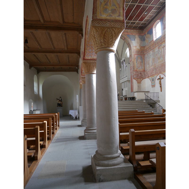 Source caption: " Interior of St. George (Reichenau) Säulen" -- partially showing the baptismal font at the far [east] end of the north aisle