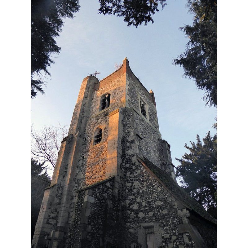 Source caption: "Ewell: the tower of the ruined church. Apart from this tower, little is left of Ewell's medieval parish church. The tower is somewhat hemmed in by tall conifers, so that even in mid-December I was unable to get an open view from a distance. In the area around the tower (at the southern end of the churchyard) there are dozens (possibly hundreds) of Georgian tombstones - so perhaps the old church was not abandoned until its replacement was built."