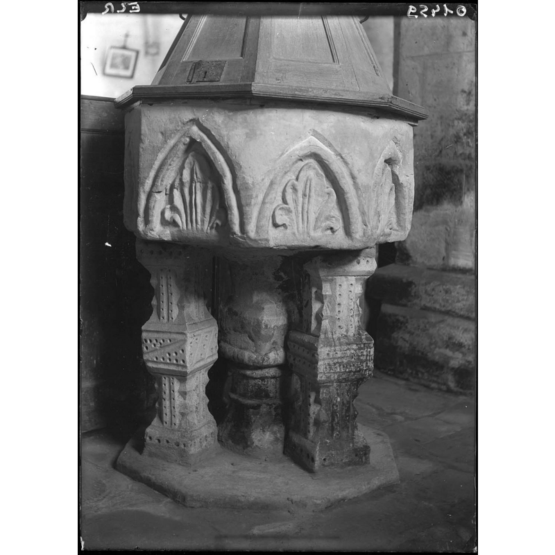 view of the 14thC(?) font showing the 18thC wooden cover partially