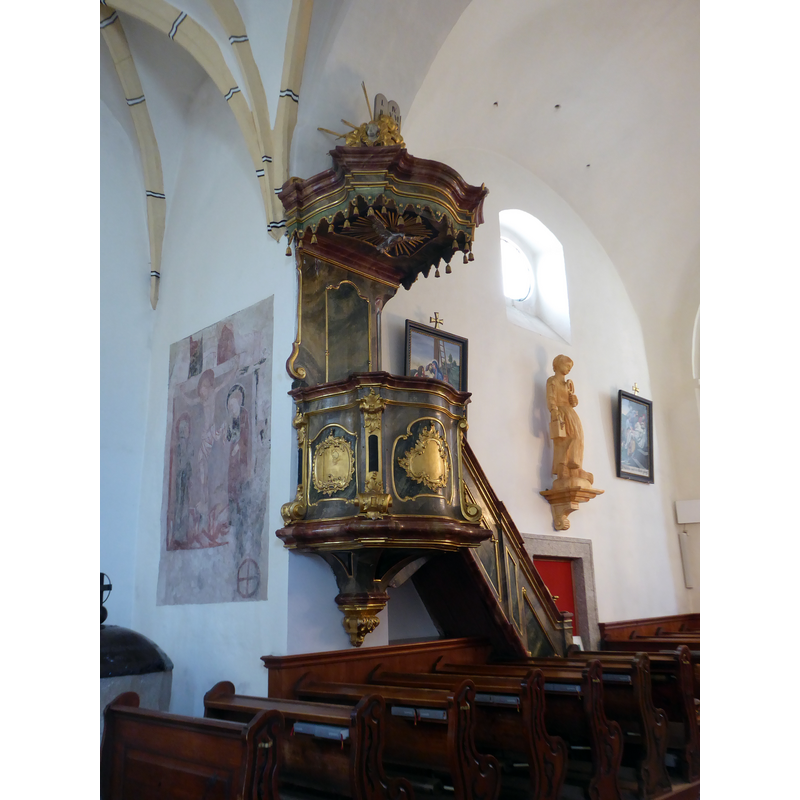 Source caption: "Pfarrkirche hl. Ägydius, Schweiggers, Niederösterreich - Rokoko-Kanzel um 1770" -- the medieval font is partially visible in the bottom-left corner of the image