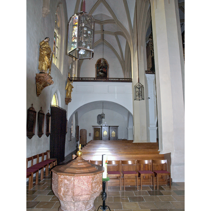 Source caption: "Kath. Pfarrkirche hl. Laurentius" -- view down the south aisle with the font and cover in the foreground