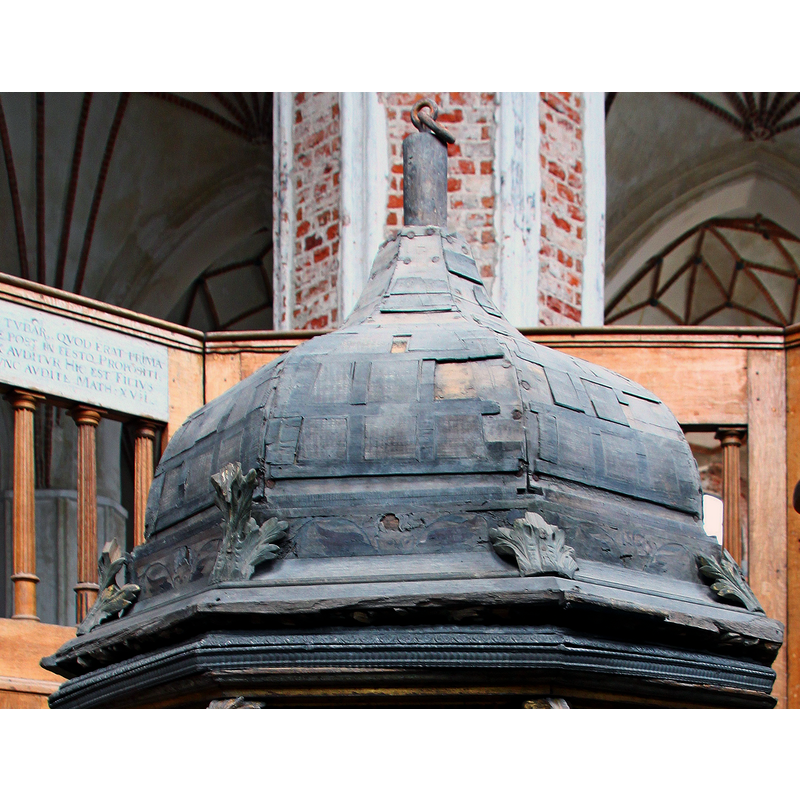 obviously in a very battered state; notice the connector for the lifting apparatus at the finial end