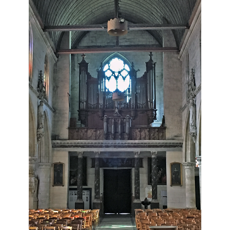 Source caption: "Bernay Sainte-Croix grandes orgues inscrites MH" -- the present baptismal font is discernible to the right of the west entranceway, seen here between the two pillars
