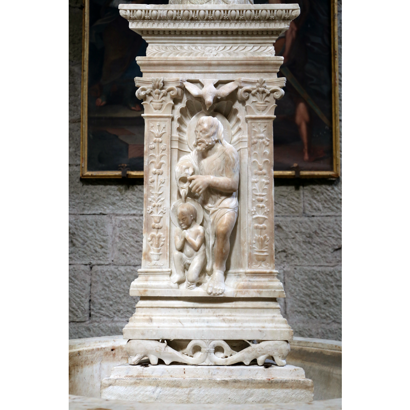 naked child-like Christ -- not part of the original basin but a later addition