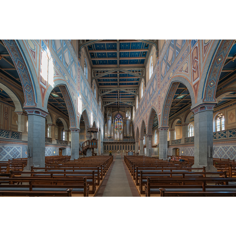 Source caption: "nnenaufnahme der Kirche St. Laurenzen in St. Gallen, Schweiz" -- showing the modern font at the far [east] end, in the centre of the image