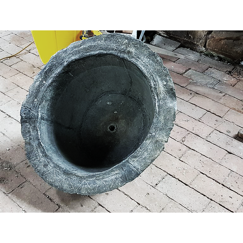 showing the font during its restoration: the lead lining of the basin