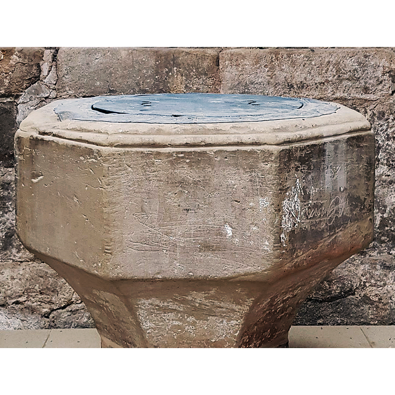 Source caption: "Close inspection of the font shows much graffiti on the outside of the font stonework, and also a pattern in the edging of the lead liner.  The age of these drawings, numbers, letters, and patterns has yet to be ascertained, but we shall spend time researching these over the next few years."