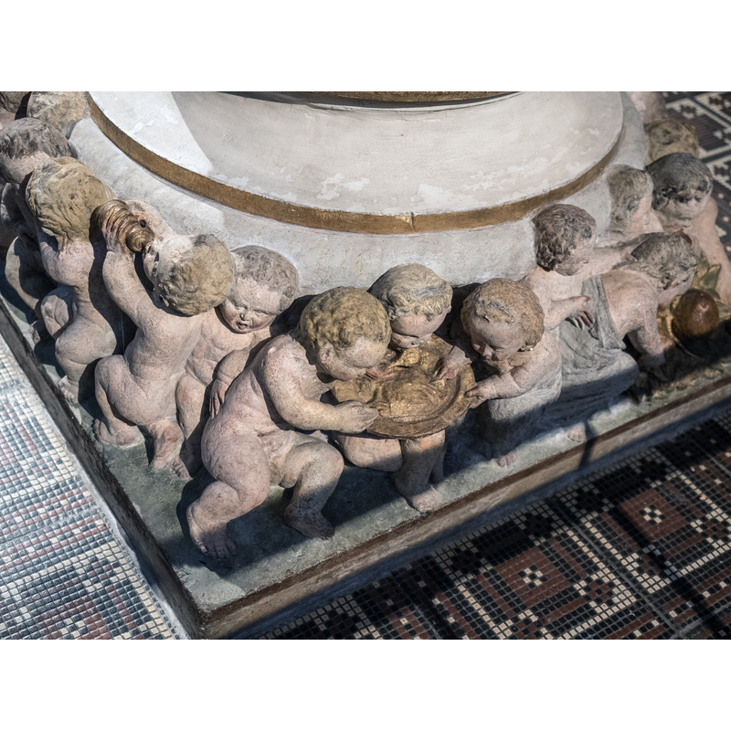 Source caption: " Fuß des Taufsteines der Marienkirche zu Pirna von 1561, Christoph Kramer aus Dresden zugeschrieben" -- children, some dressed, some naked; they hug, eat, drink, look at each other, play with animals, sleep, etc.