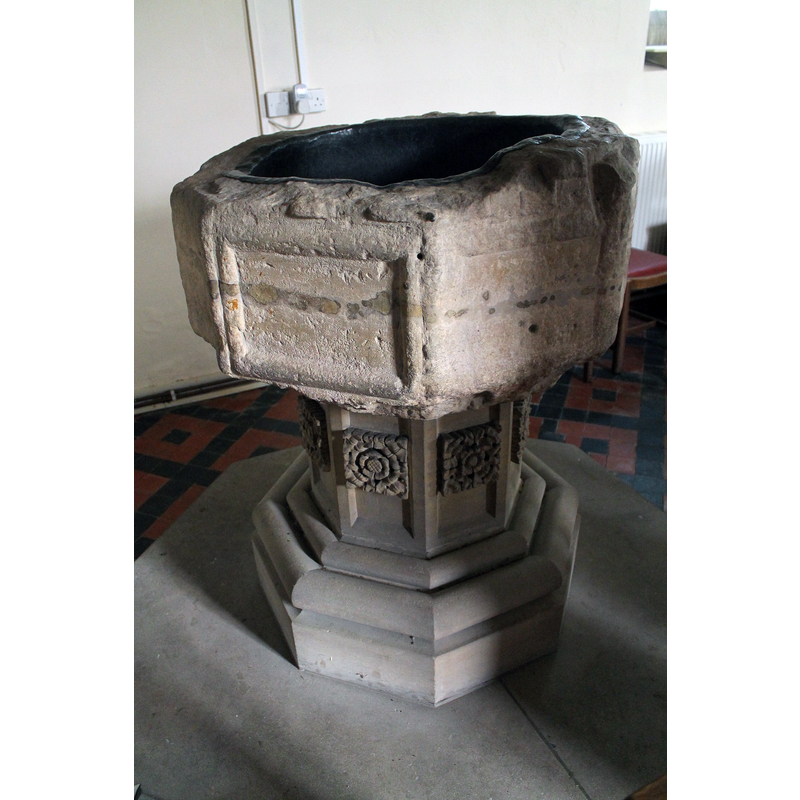 Font, St Martin's Church, Welton Le Marsh. The church has a medieval base and was rebuilt in later 18th C. in red brick. Western tower. The inside is very plain with a 15th C octagonal font."