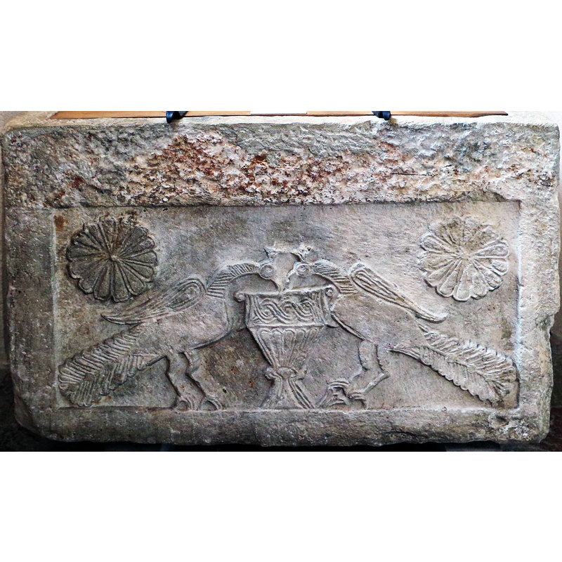 on the front side of the baptismal font in the cathedral museum