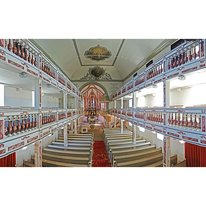 Source caption: "Gertrudiskirche in Saalfeld-Graba, Blick zum Chor" -- showing the baptismal font at the east end of the nave, in the centre