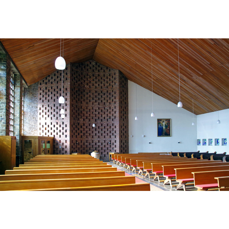 Source caption: "St. Peter und Paul (Auw bei Prüm), Kirchenraum nach Süden" -- showing the modern font at the far end of the modern south extension to the old church