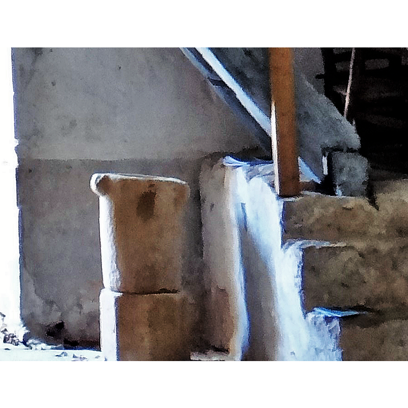 at the west end of the nave, by the stairwell to the gallery