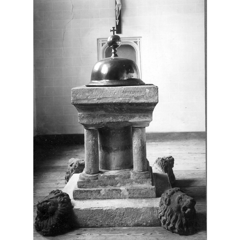 19thC cover on the 13thC font -- the lion heads shown here were not originally part of the lower base and were later removed