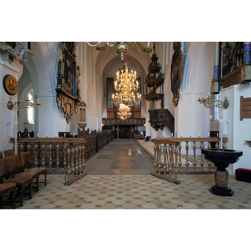 Source caption: "Sankt Nicolai Kirke Koege Denmark interior from altar" -- the baptismal font in the foreground, right [north] side