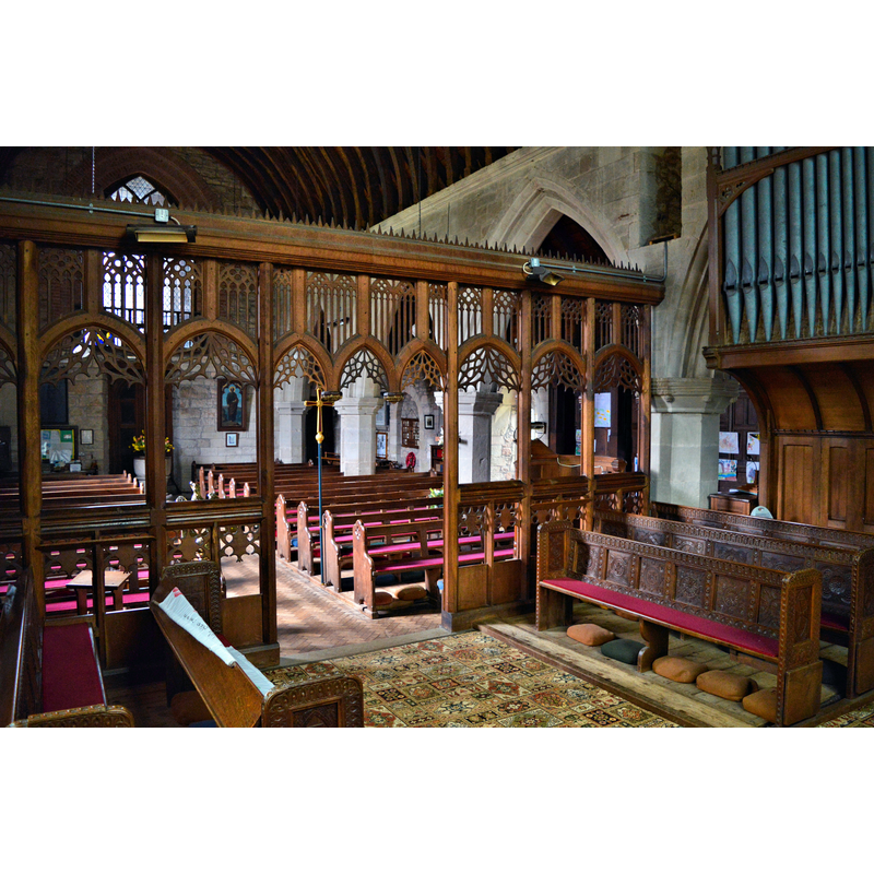 Source caption: "St Peter, Chelmarsh. The restored rood screen." -- showing the [modern] baptismal font by the west doorway