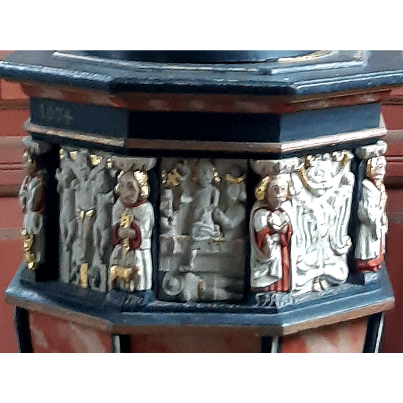 scenes of the Life of Christ on the eight panels of the basin: the Crucifixion on the left; Last Supper(?) in the centre